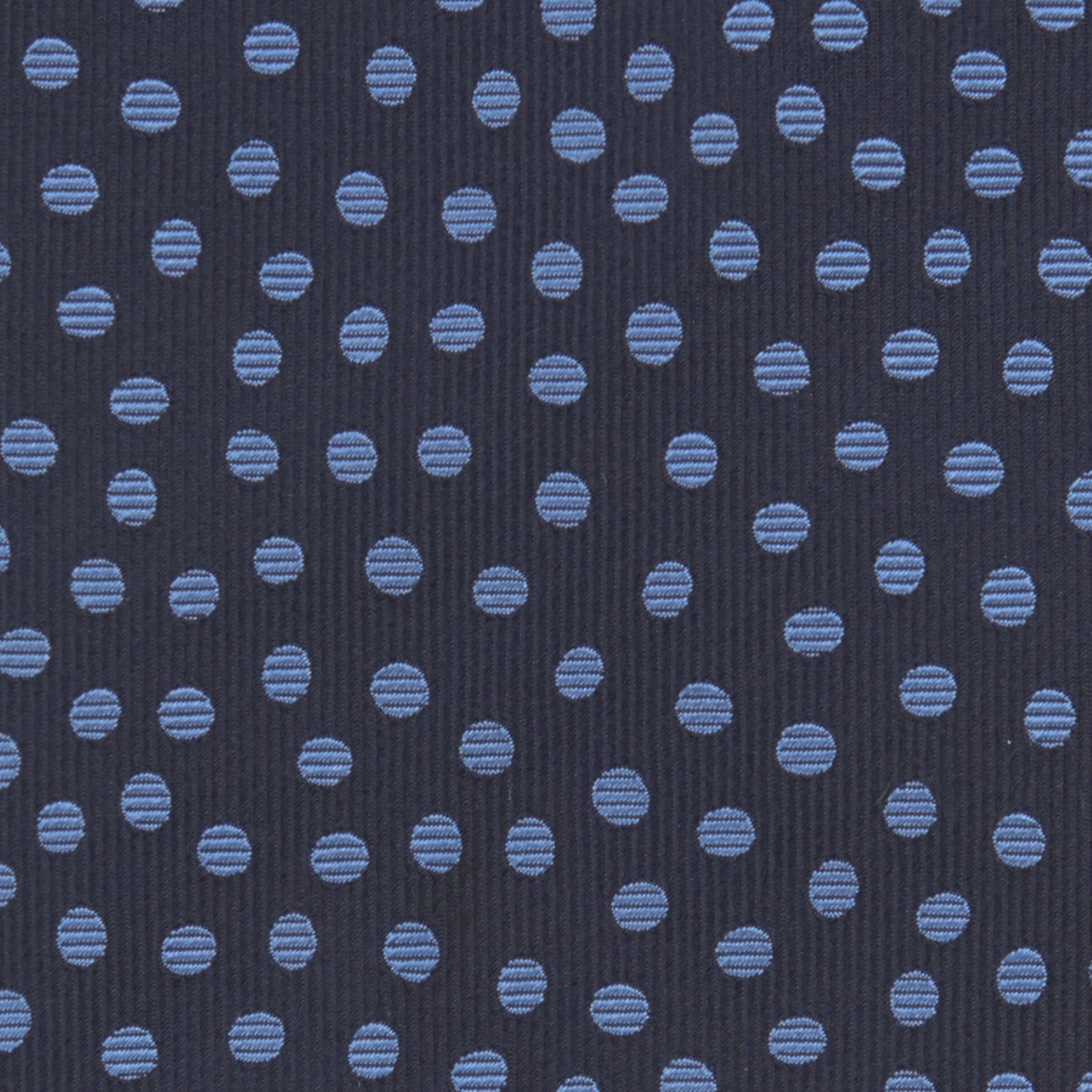 View 3 of product The Turnbull & Asser Navy and Blue Paint Spot Silk Tie features a classic dark navy design with evenly spaced light blue spots, ideal for office wear and shown on a plain white background.