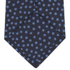 View 4 of product The Turnbull & Asser Navy and Blue Paint Spot Silk Tie features a classic dark navy design with evenly spaced light blue spots, ideal for office wear and shown on a plain white background.