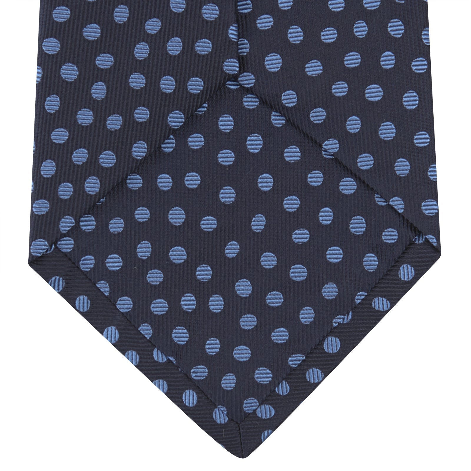 View 4 of product The Turnbull & Asser Navy and Blue Paint Spot Silk Tie features a classic dark navy design with evenly spaced light blue spots, ideal for office wear and shown on a plain white background.