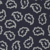 View 3 of product The Turnbull & Asser Navy and White Petal Paisley Silk Tie, featuring an elegant abstract pattern, is neatly rolled against a plain white background.