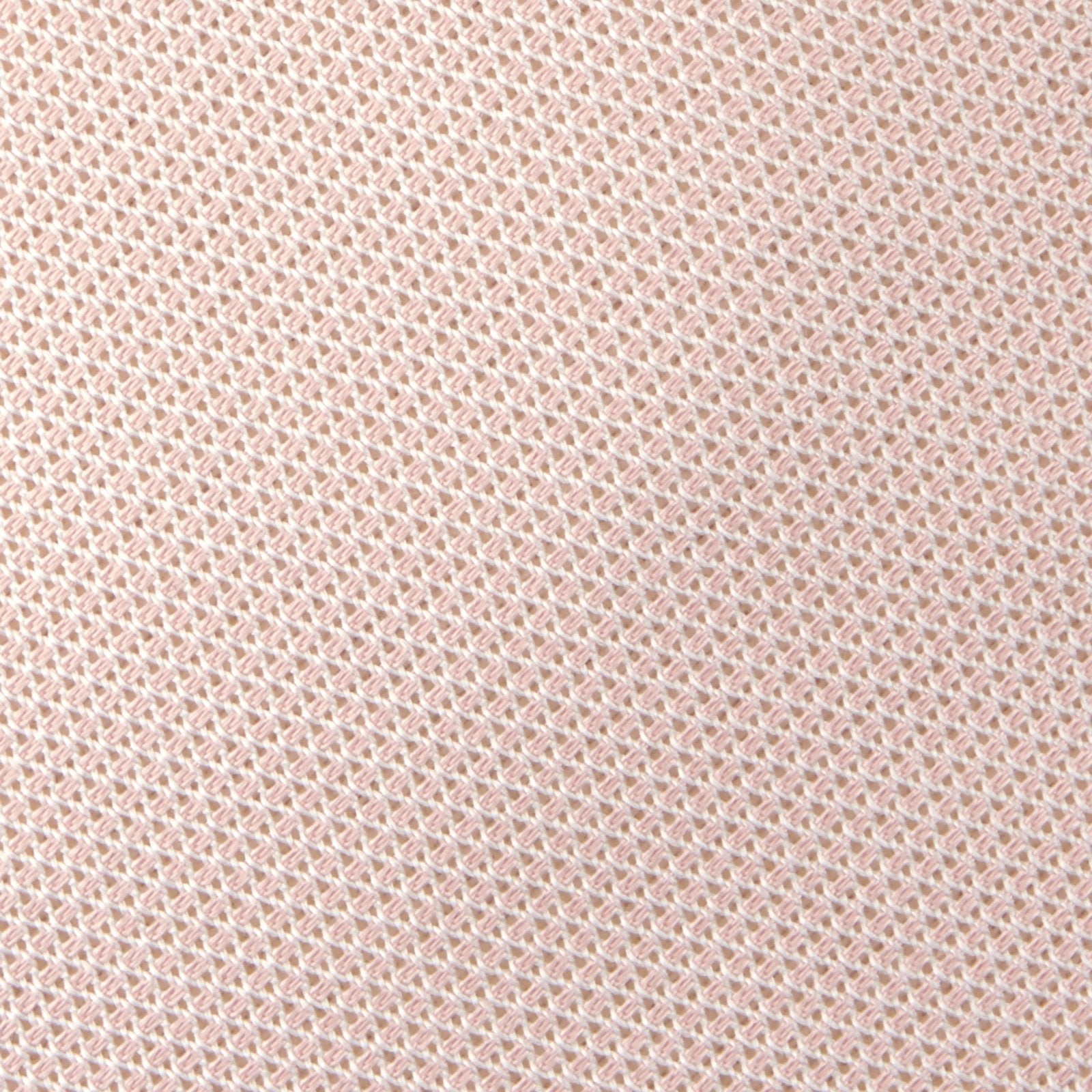 View 3 of product The Turnbull & Asser Light Pink Grenadine Silk Tie features a subtle woven pattern, shown rolled up on a plain white background.