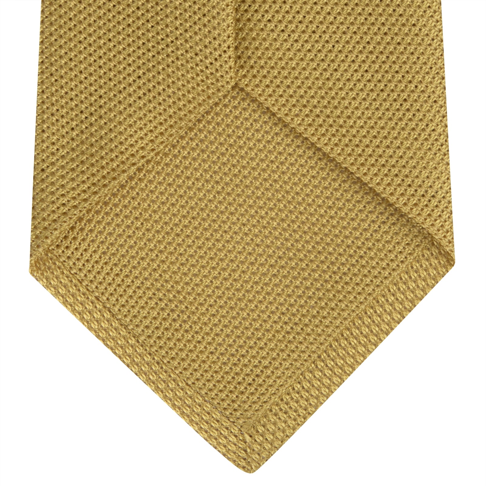 View 4 of product The Turnbull & Asser Gold Grenadine Silk Tie, recognized for its dimensional stability, is shown rolled up against a plain white background.