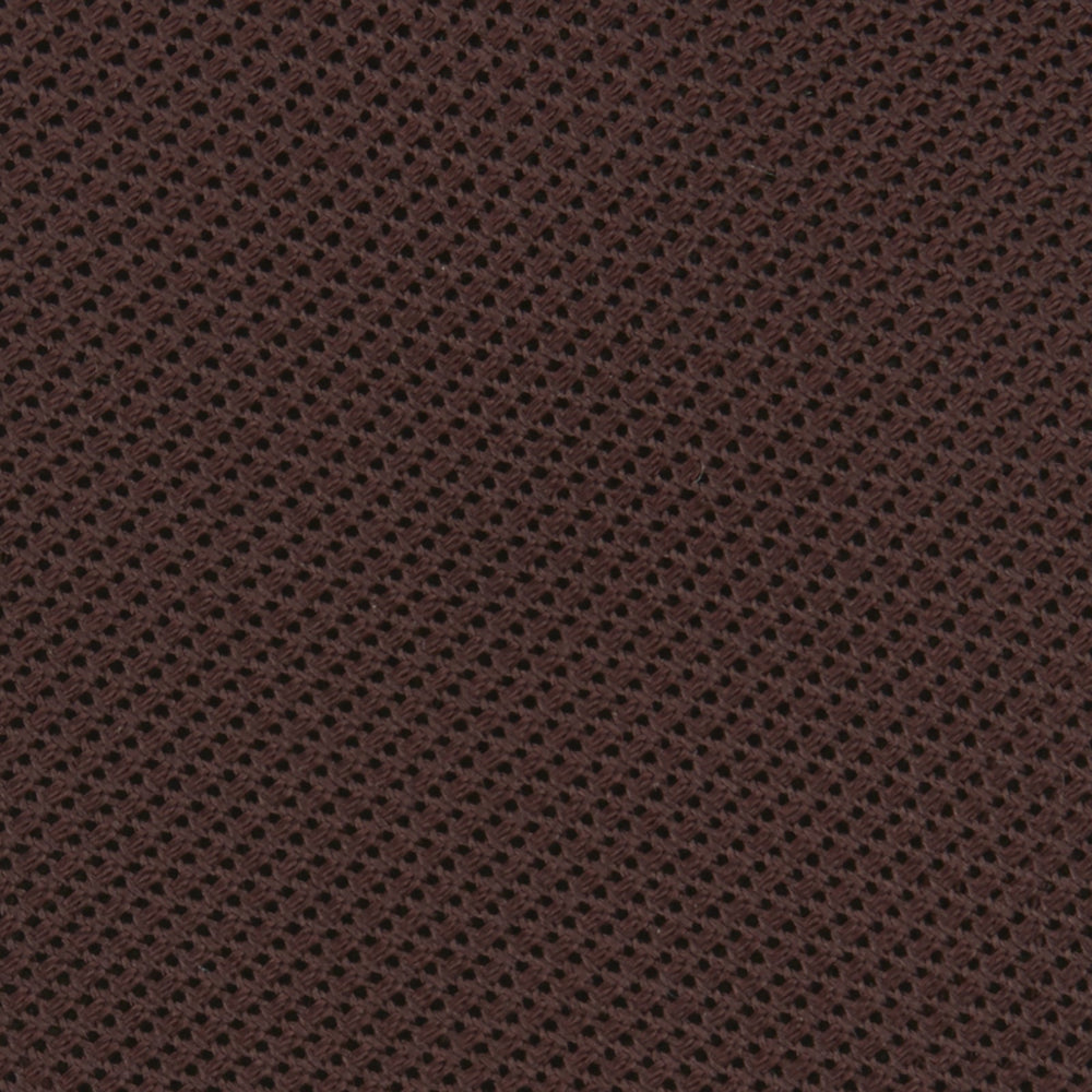 The Turnbull & Asser Burgundy Grenadine Silk Tie, featuring a textured grenadine weave, is rolled up and displayed against a plain white background.