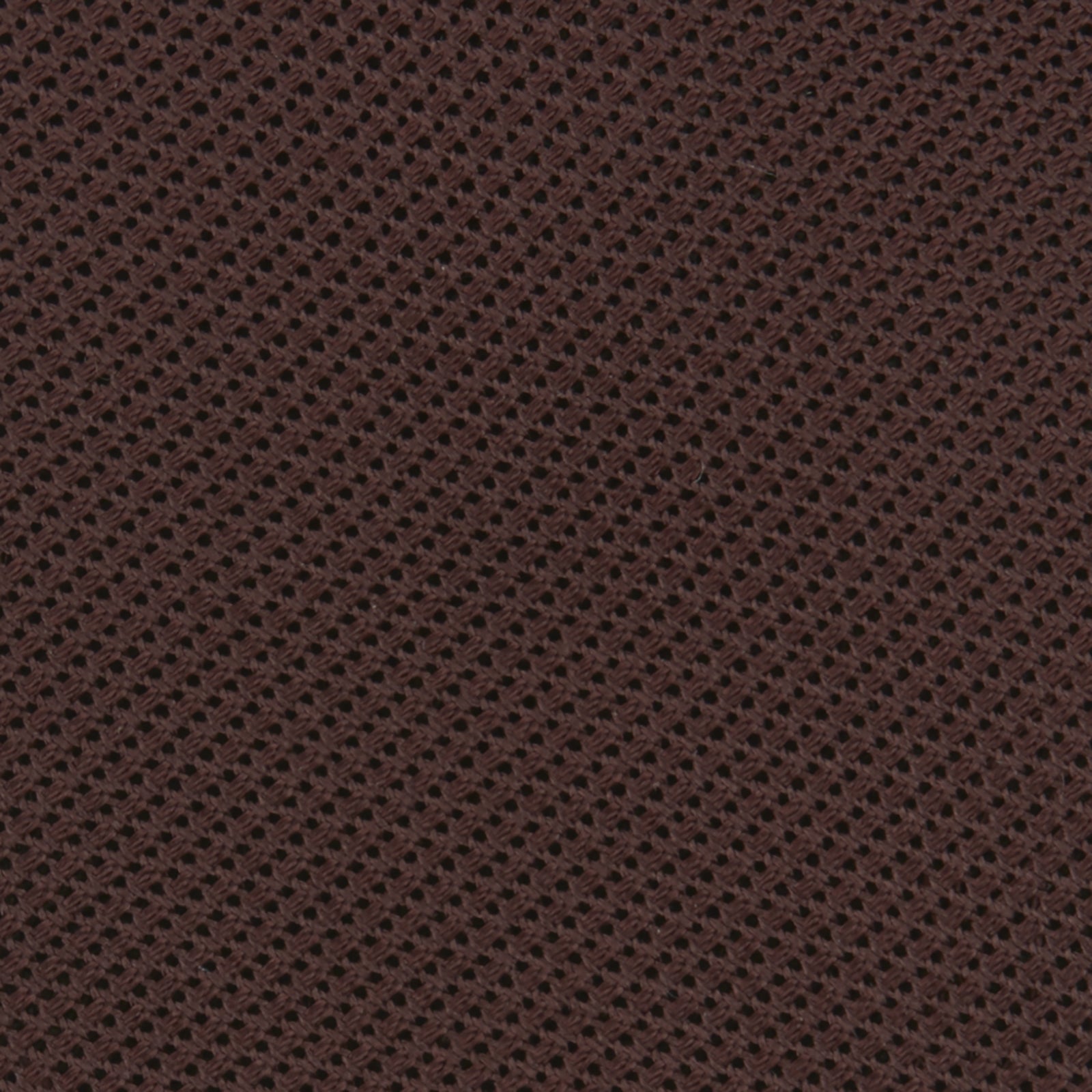 View 3 of product The Turnbull & Asser Burgundy Grenadine Silk Tie, featuring a textured grenadine weave, is rolled up and displayed against a plain white background.