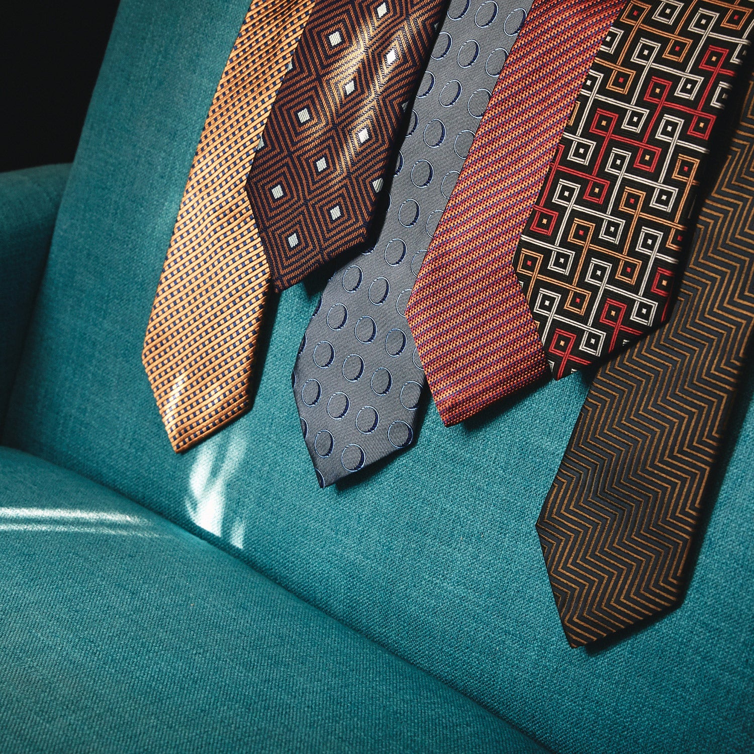 View 6 of product The Turnbull & Asser Die Another Day Circle Silk Tie, as seen on James Bond, features large dark blue ovals on a lighter blue background.