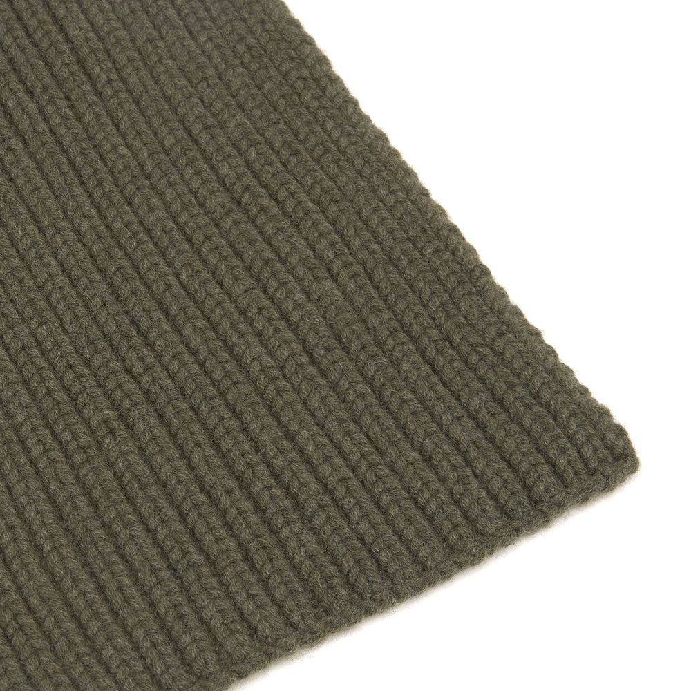 The Turnbull & Asser Khaki Green Knitted Cashmere Scarf is laid flat with one end looped through the other, showcasing its thick, cozy texture—an ideal winter accessory.