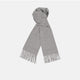 The Flannel Grey Pure Cashmere Scarf by Turnbull & Asser is crafted from soft cashmere, showcased neatly folded with fringed ends on a plain white background.