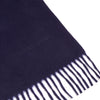 View 2 of product The Turnbull & Asser Navy Pure Cashmere Scarf, featuring fringed ends, is neatly folded and displayed on a plain white background—the perfect winter accessory.