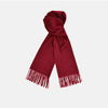 View 1 of product The Turnbull & Asser Bordeaux Pure Cashmere Scarf, in deep red with a soft texture and fringed ends, is neatly folded and displayed on a plain white background.