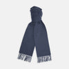 View 1 of product The Turnbull & Asser Slate Pure Cashmere Scarf is a luxurious navy blue accessory with fringed ends, neatly folded and showcased on a plain white background.