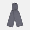 View 1 of product The Plain Grey Silk Scarf by Turnbull & Asser features fringed edges and the brand name in white near one end, neatly folded and elegantly displayed on a plain white background.