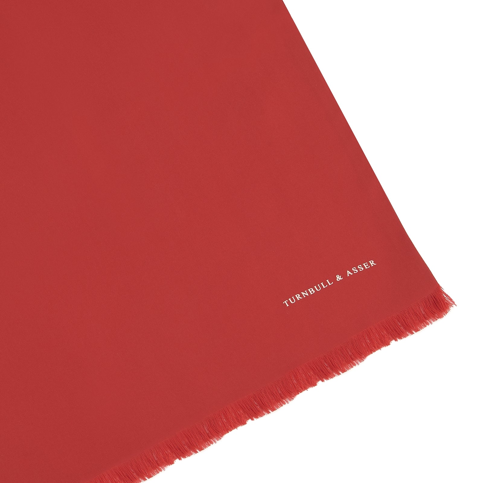 View 2 of product A Plain Red Silk Scarf by Turnbull & Asser is neatly folded and laid flat on a white background, featuring small white "Turnbull & Asser" text in one corner.
