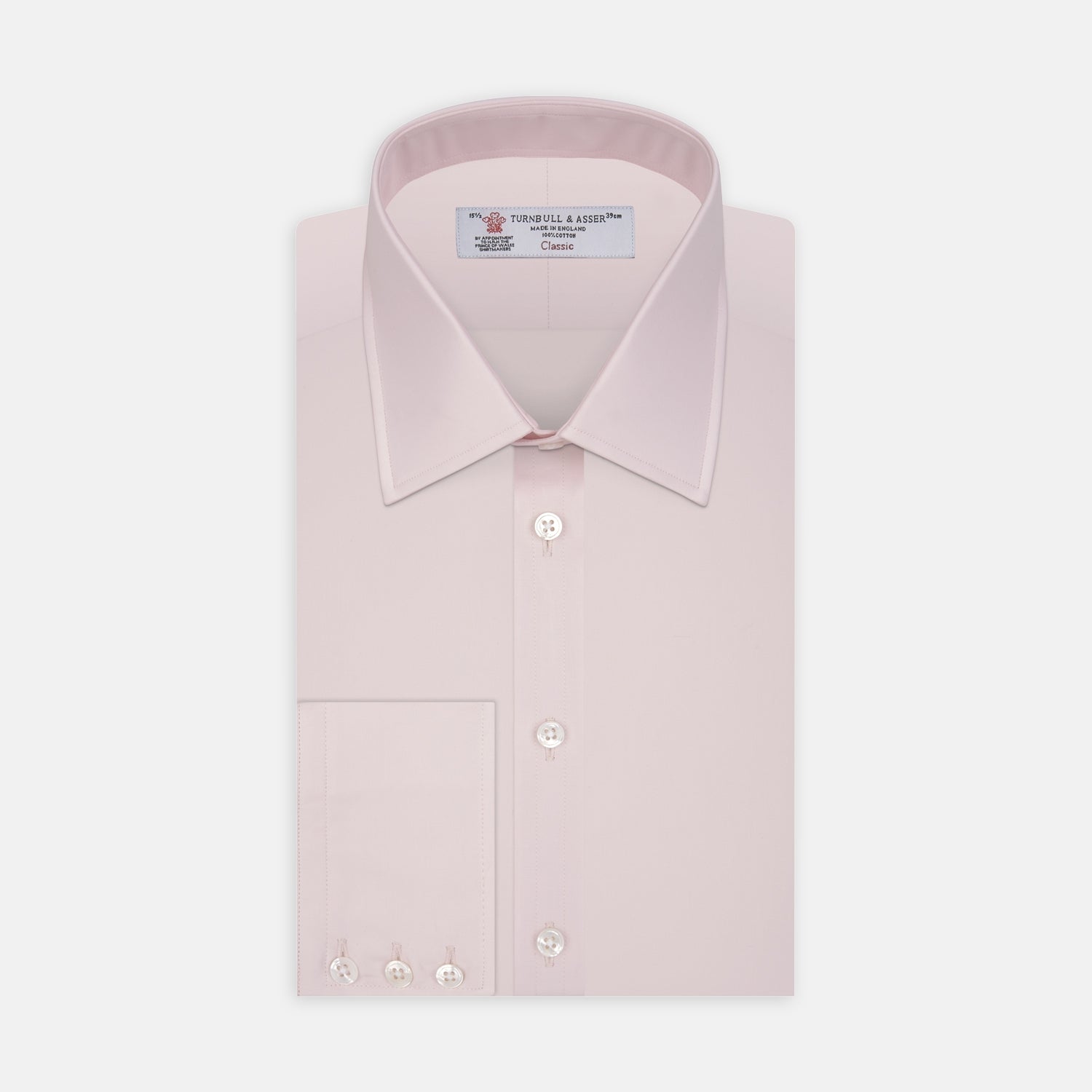 View 1 of product The Turnbull & Asser Pink Cotton Shirt features a T&A collar, 3-button cuffs, and a front pocket. Its clean-cut design is ideal for formal occasions and pairs well with masculine accessories. Displayed against a white background.