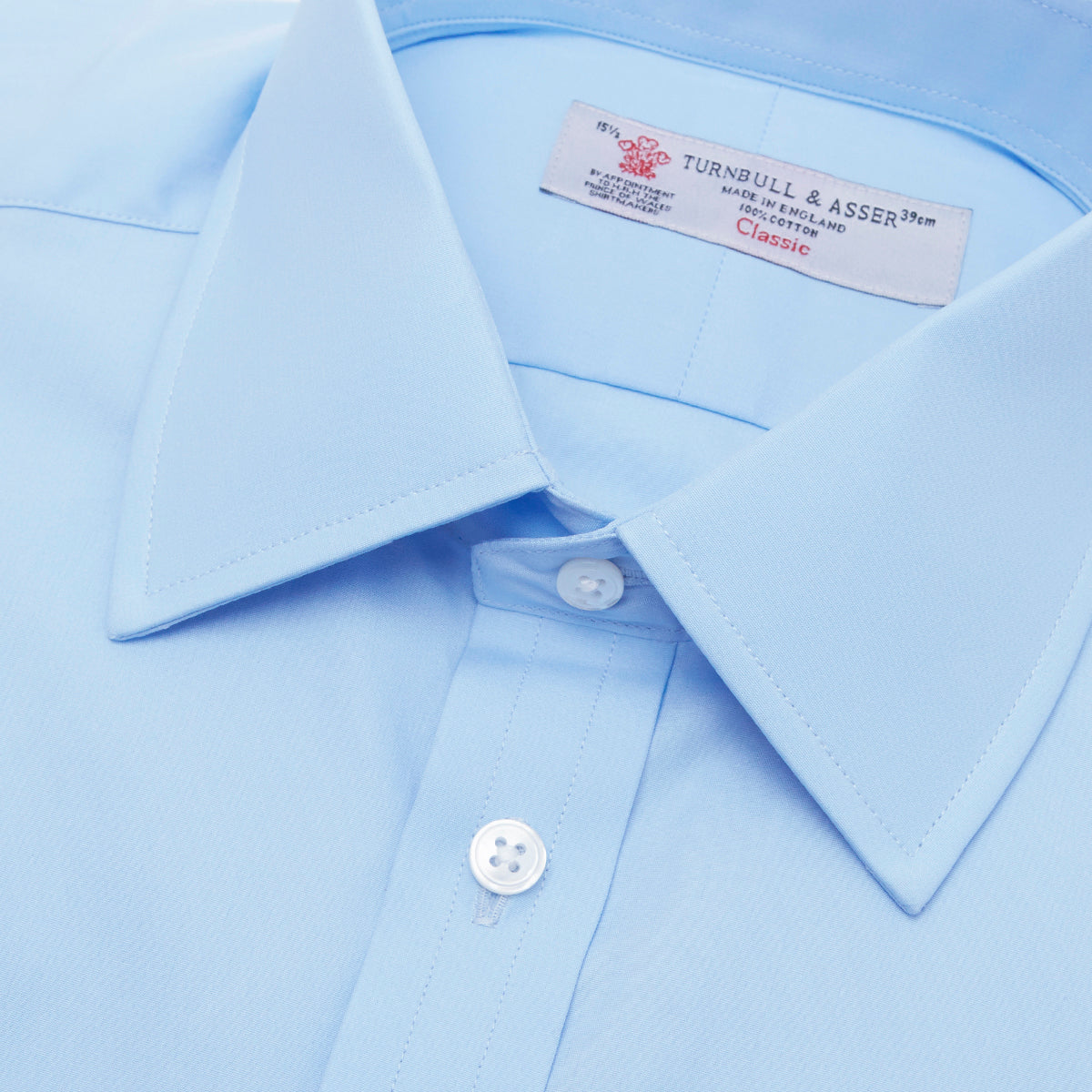View 5 of product A Light Blue Cotton Shirt with T&A Collar and Double Cuffs by Turnbull & Asser, neatly folded and displayed on a plain white background.