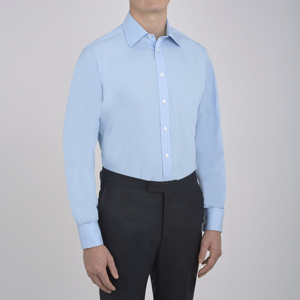 A Light Blue Cotton Shirt with T&A Collar and Double Cuffs by Turnbull & Asser, neatly folded and displayed on a plain white background.