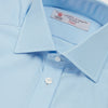 View 5 of product A Turnbull & Asser Blue Shirt with Regent Collar and 2-Button Cocktail Cuffs is neatly folded, featuring white buttons, and displayed on a plain white background.
