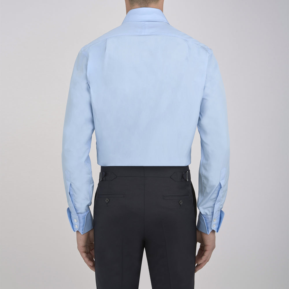 A Turnbull & Asser Blue Shirt with Regent Collar and 2-Button Cocktail Cuffs is neatly folded, featuring white buttons, and displayed on a plain white background.