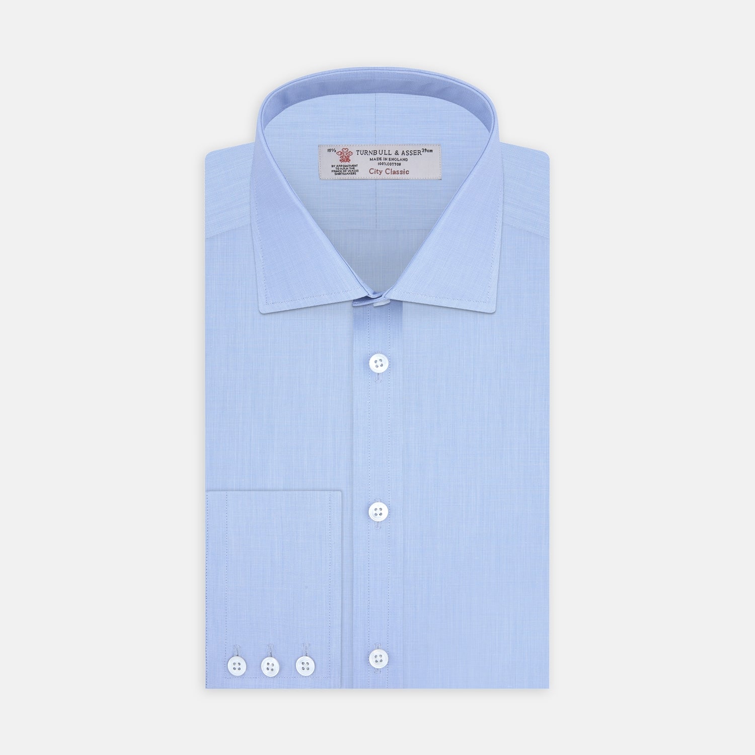 View 1 of product The Turnbull & Asser Light Blue End On End Shirt with Regent Collar and 3 Button Cuffs is shown neatly folded on a white background, featuring a visible chest pocket and brand label inside the collar.