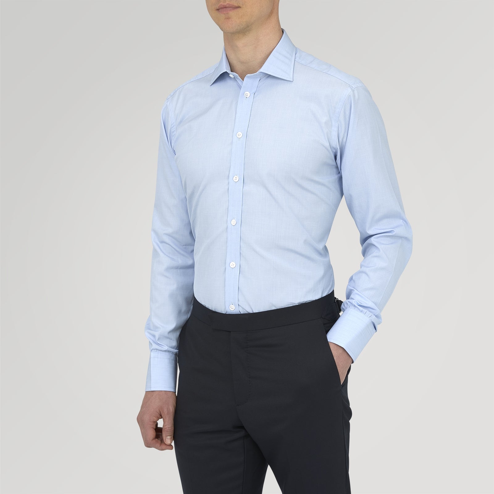 View 2 of product The Turnbull & Asser Light Blue End On End Shirt with Regent Collar and 3 Button Cuffs is shown neatly folded on a white background, featuring a visible chest pocket and brand label inside the collar.