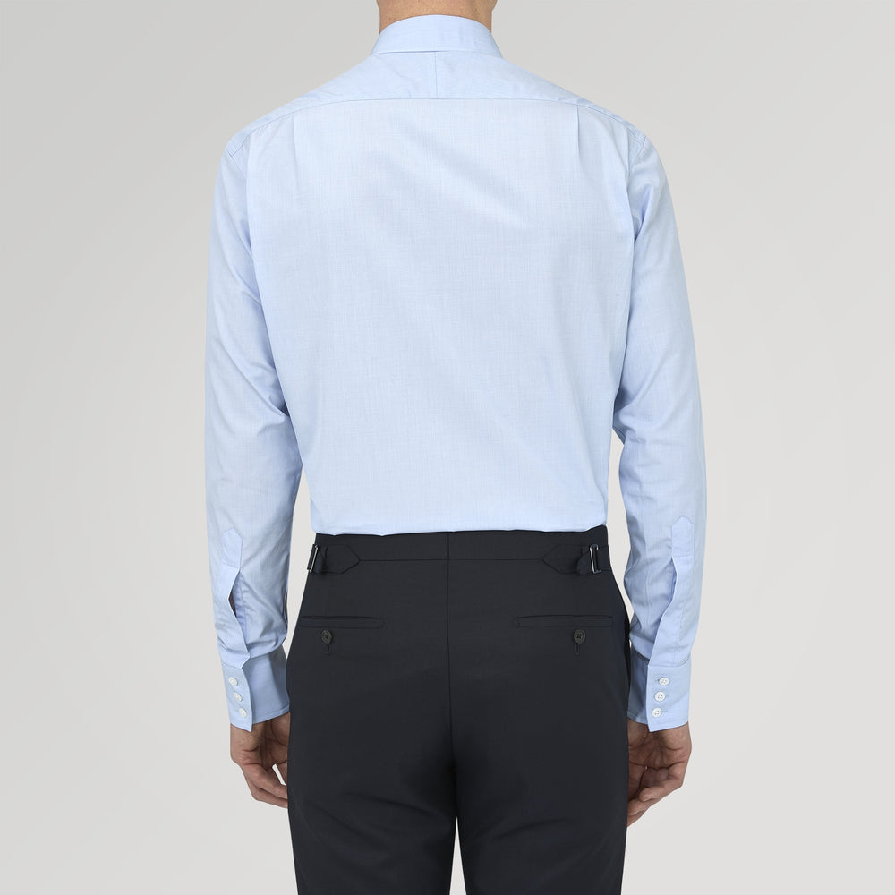 The Turnbull & Asser Light Blue End On End Shirt with Regent Collar and 3 Button Cuffs is shown neatly folded on a white background, featuring a visible chest pocket and brand label inside the collar.