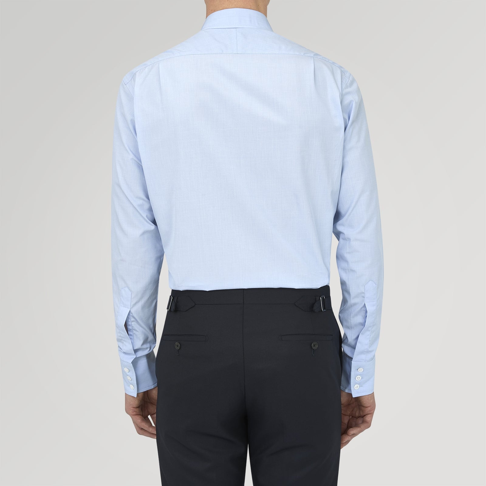 View 3 of product The Turnbull & Asser Light Blue End On End Shirt with Regent Collar and 3 Button Cuffs is shown neatly folded on a white background, featuring a visible chest pocket and brand label inside the collar.