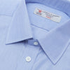 View 5 of product The Turnbull & Asser Blue End-on-End Cotton Shirt features a T&A collar, double cuffs, white buttons, and a chest pocket. Displayed neatly folded on a white background with the label visible at the neck—ideal for refined style.