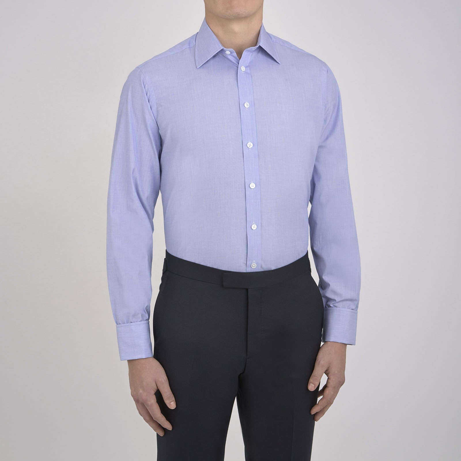 View 2 of product The Turnbull & Asser Blue End-on-End Cotton Shirt features a T&A collar, double cuffs, white buttons, and a chest pocket. Displayed neatly folded on a white background with the label visible at the neck—ideal for refined style.