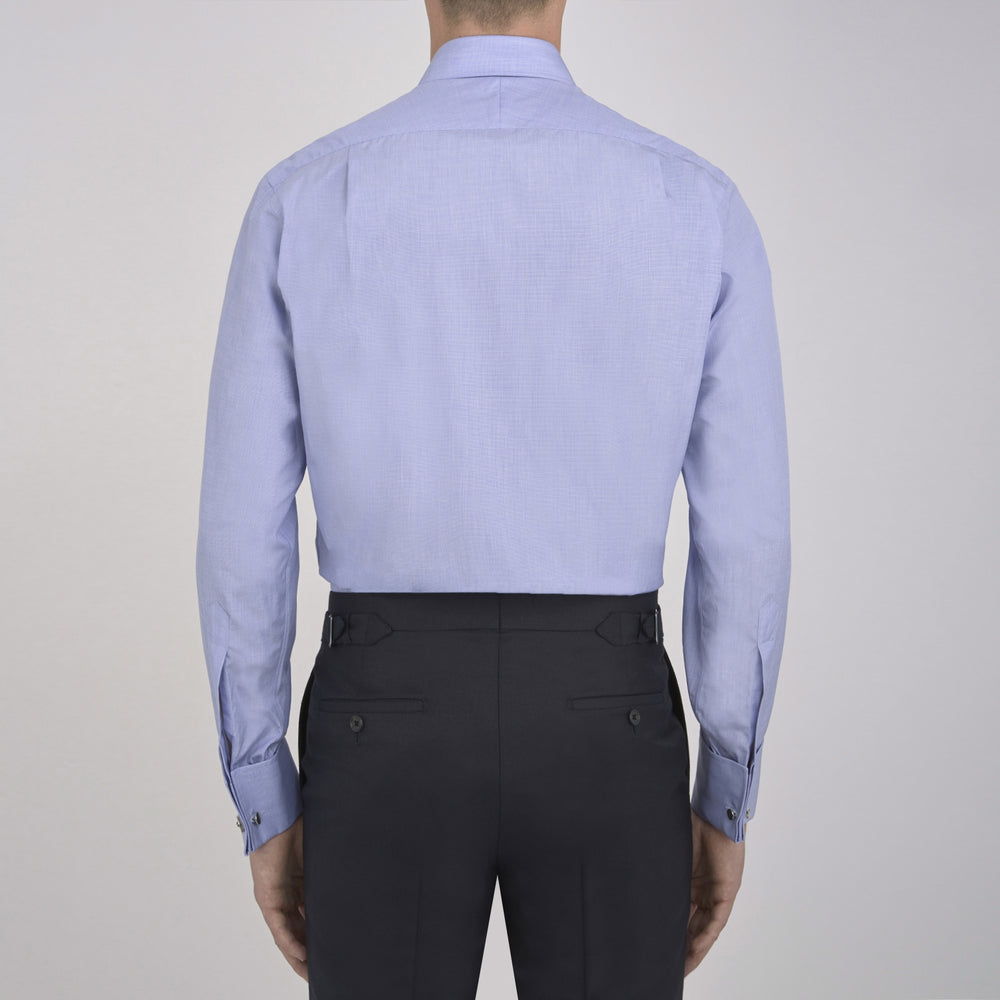 The Turnbull & Asser Blue End-on-End Cotton Shirt features a T&A collar, double cuffs, white buttons, and a chest pocket. Displayed neatly folded on a white background with the label visible at the neck—ideal for refined style.