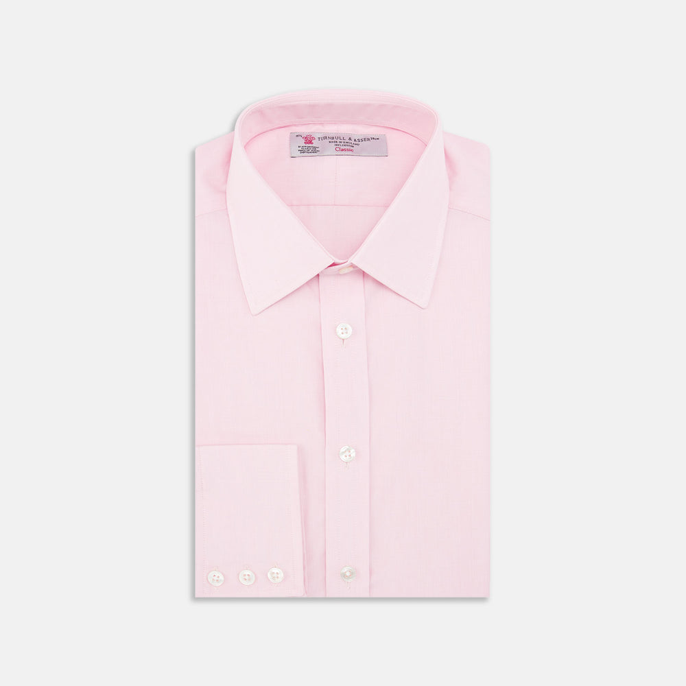 The Turnbull & Asser Pink End-on-End Shirt features a T&A collar, 3-button cuffs, and white buttons—a refined choice for any smart look—shown neatly folded against a plain white background.