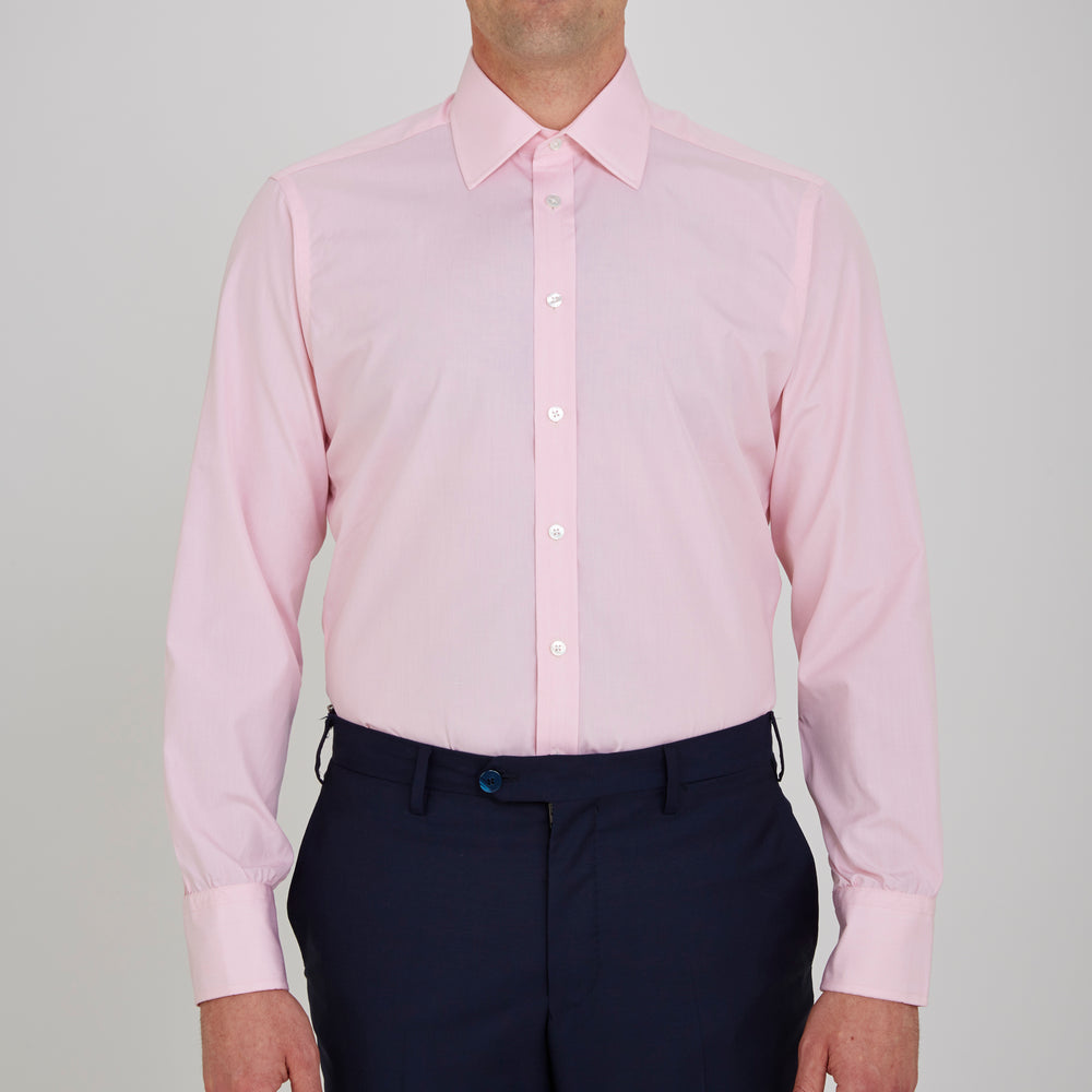 The Turnbull & Asser Pink End-on-End Shirt features a T&A collar, 3-button cuffs, and white buttons—a refined choice for any smart look—shown neatly folded against a plain white background.