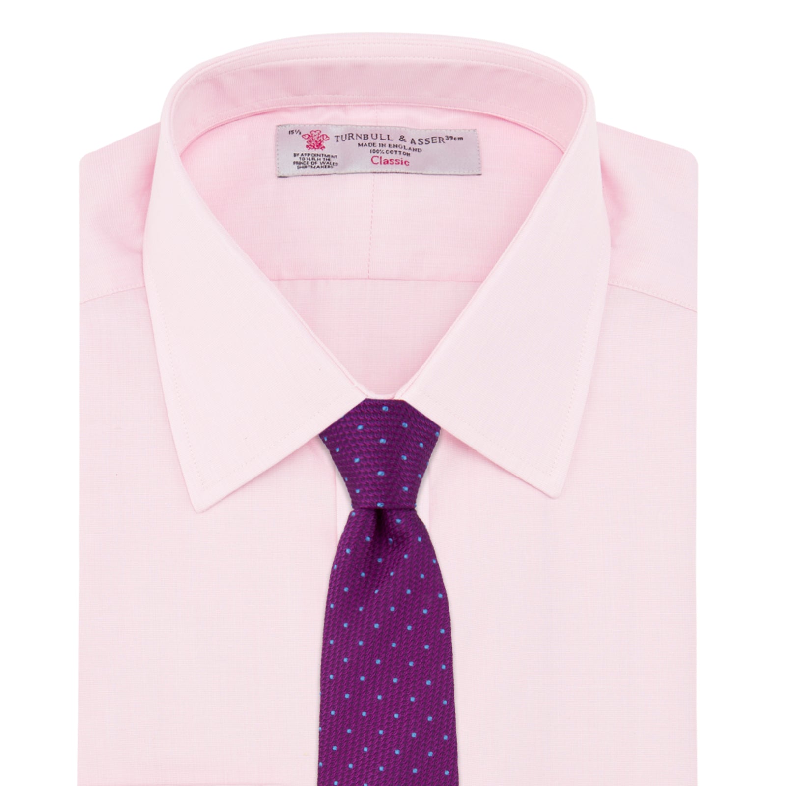 View 4 of product The Turnbull & Asser Pink End-on-End Shirt features a T&A collar, 3-button cuffs, and white buttons—a refined choice for any smart look—shown neatly folded against a plain white background.