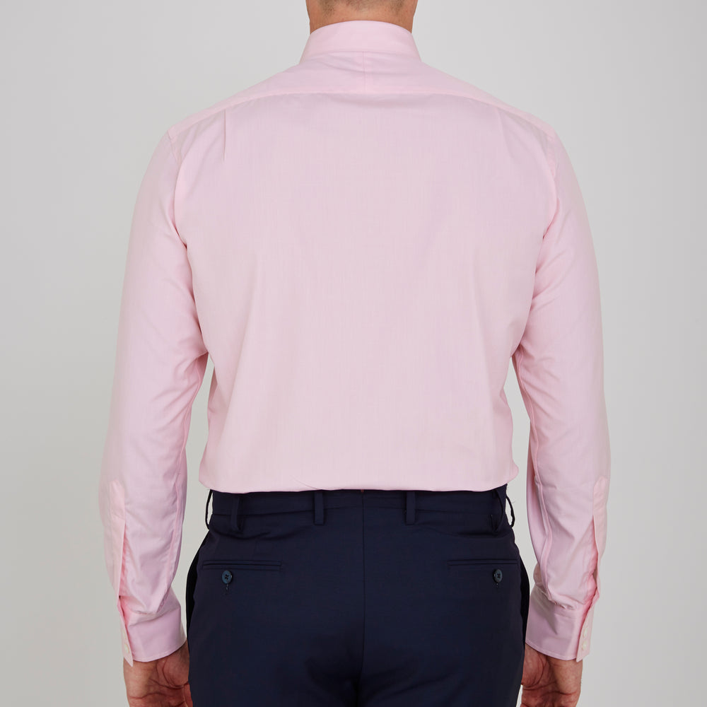 The Turnbull & Asser Pink End-on-End Shirt features a T&A collar, 3-button cuffs, and white buttons—a refined choice for any smart look—shown neatly folded against a plain white background.