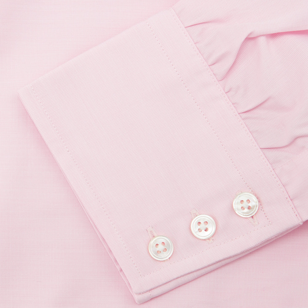 The Turnbull & Asser Pink End-on-End Shirt features a T&A collar, 3-button cuffs, and white buttons—a refined choice for any smart look—shown neatly folded against a plain white background.