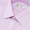 View 5 of product A neatly folded Turnbull & Asser Lilac End-on-End Shirt with T&A collar and 3-button cuffs, featuring white buttons and long sleeves, is displayed on a plain white background.