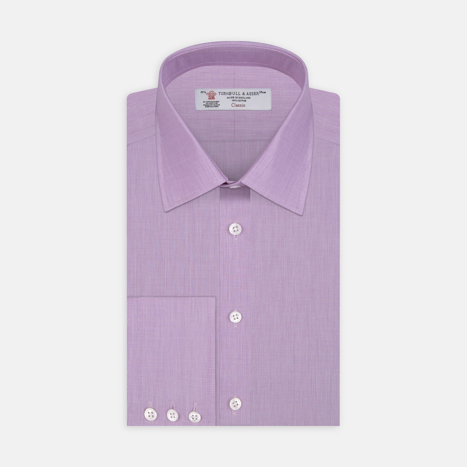 View 1 of product A neatly folded Turnbull & Asser Lilac End-on-End Shirt with T&A collar and 3-button cuffs, featuring white buttons and long sleeves, is displayed on a plain white background.