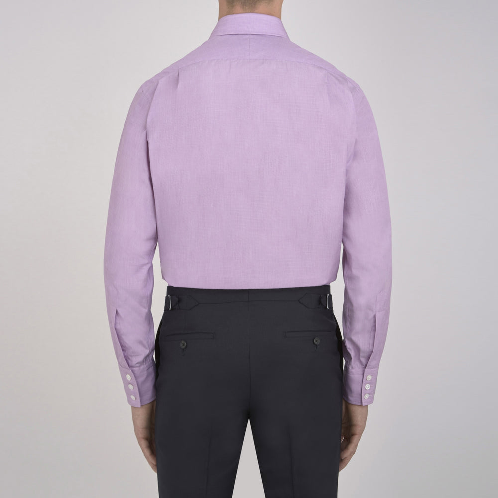 A neatly folded Turnbull & Asser Lilac End-on-End Shirt with T&A collar and 3-button cuffs, featuring white buttons and long sleeves, is displayed on a plain white background.