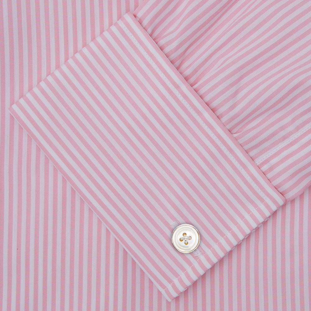 A neatly folded Turnbull & Asser blue shirt with a regent collar and 2-button cocktail cuffs, displayed against a plain white background.