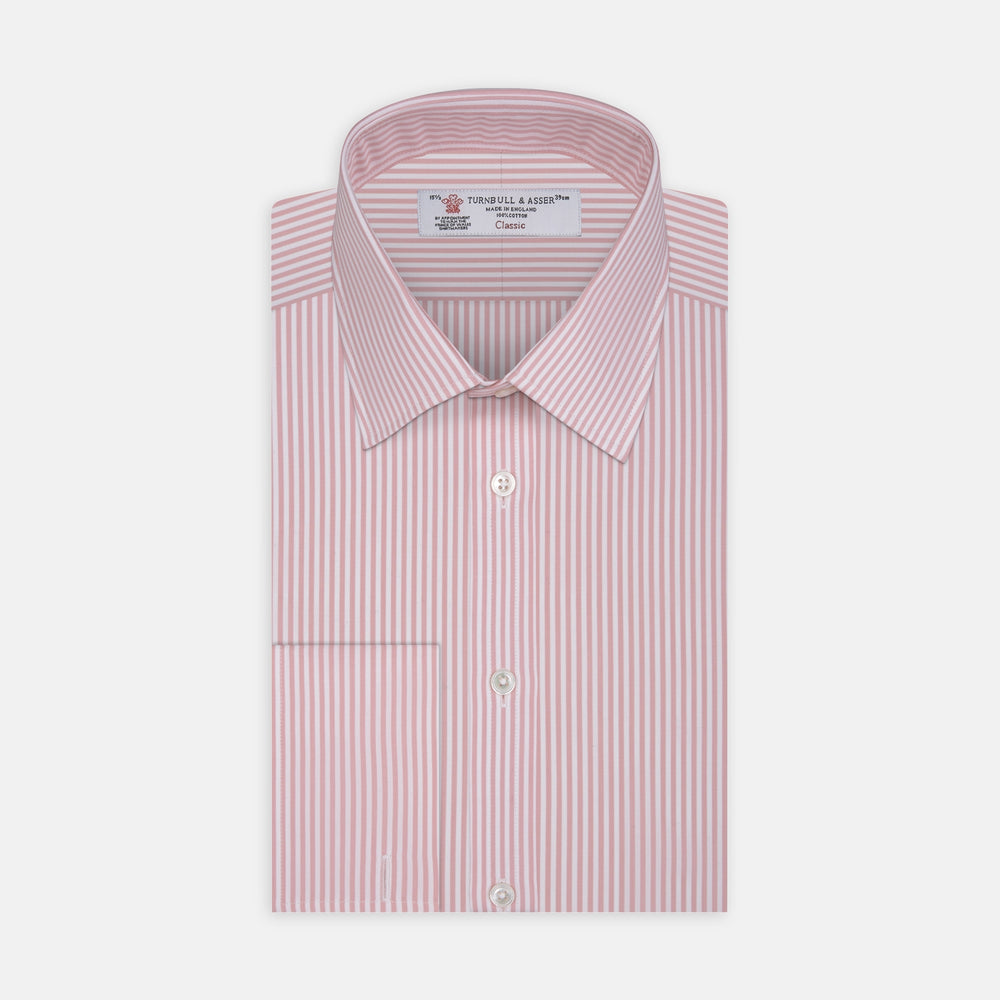 A neatly folded Turnbull & Asser blue shirt with a regent collar and 2-button cocktail cuffs, displayed against a plain white background.