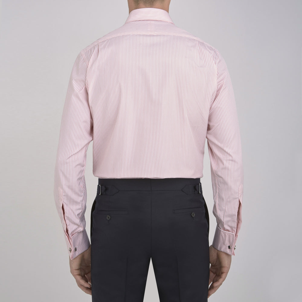 A neatly folded Turnbull & Asser blue shirt with a regent collar and 2-button cocktail cuffs, displayed against a plain white background.