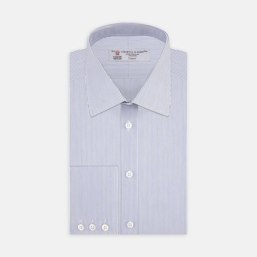The Turnbull & Asser Blue and White Fine Stripe Shirt features a T&A collar, 3-button cuffs, and white buttons, shown neatly folded on a white background.
