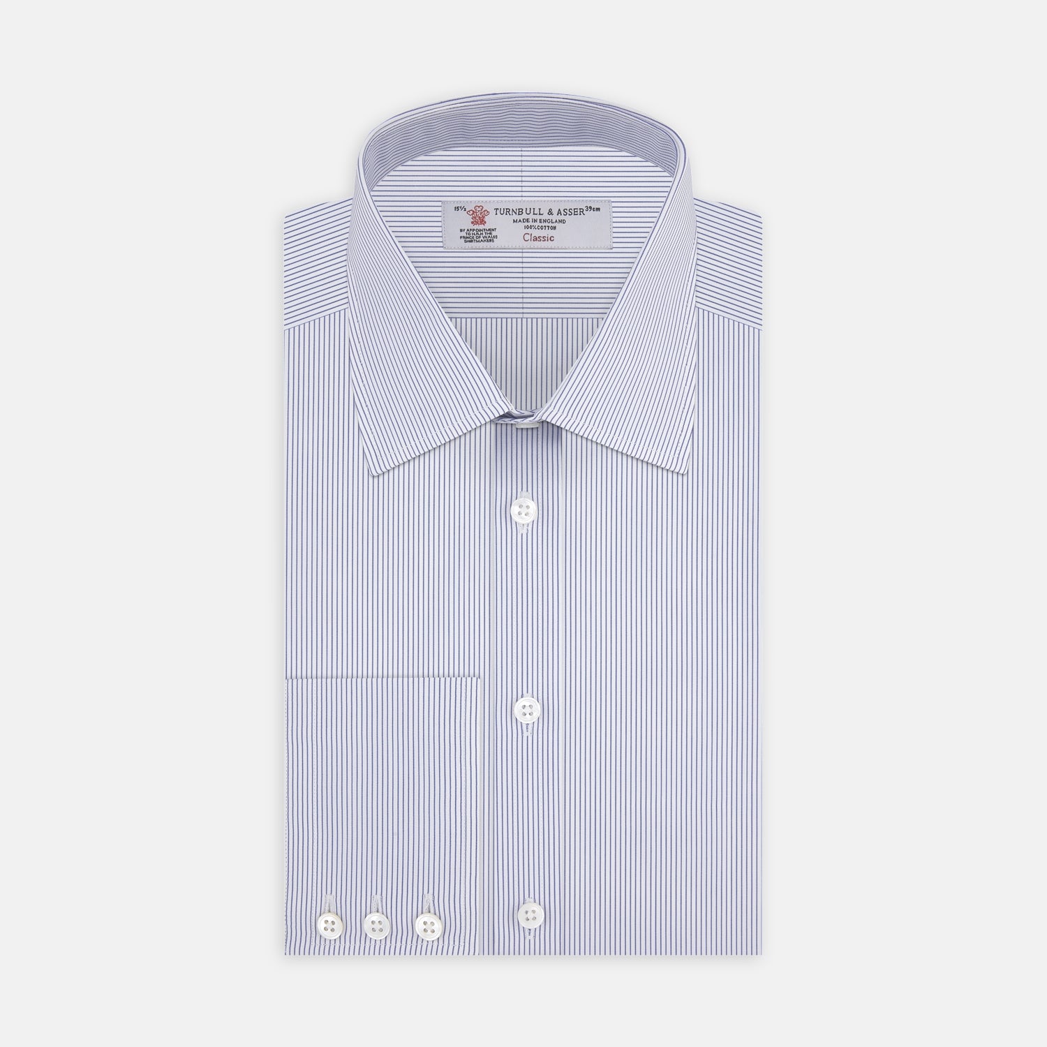 View 1 of product The Turnbull & Asser Blue and White Fine Stripe Shirt features a T&A collar, 3-button cuffs, and white buttons, shown neatly folded on a white background.