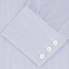 View 2 of product The Turnbull & Asser Blue and White Fine Stripe Shirt features a T&A collar, 3-button cuffs, and white buttons, shown neatly folded on a white background.