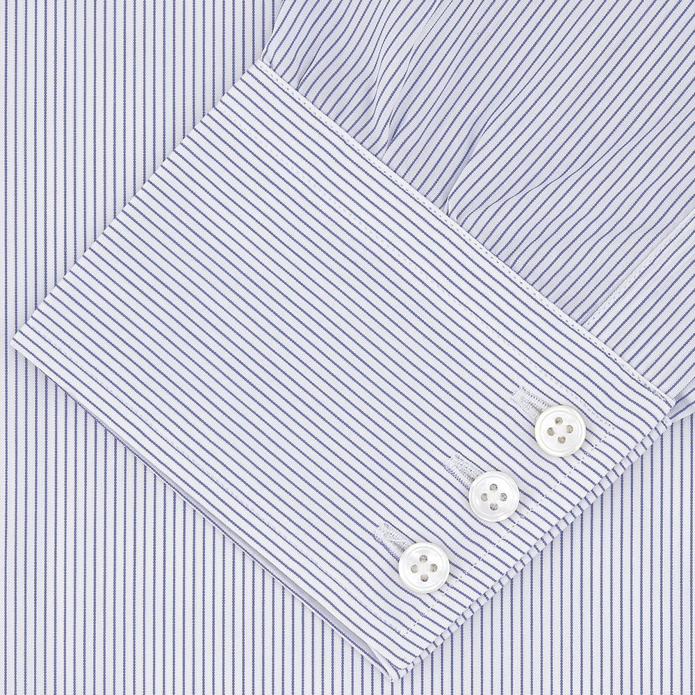 The Turnbull & Asser Blue and White Fine Stripe Shirt features a T&A collar, 3-button cuffs, and white buttons, shown neatly folded on a white background.