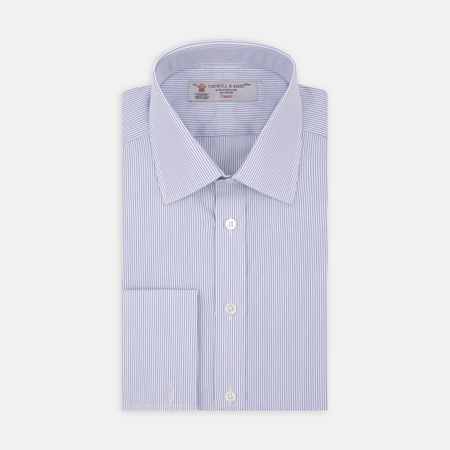 View 1 of product The Blue and White Fine Stripe Cotton Shirt by Turnbull & Asser features a T&A collar and double cuff, displayed neatly folded with white buttons against a plain white background.
