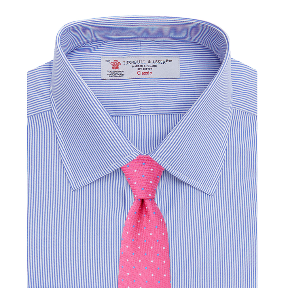 The Turnbull & Asser Blue Fine Bengal Stripe Shirt features a classic T&A collar, white buttons, and 3-button cuffs, displayed neatly folded against a plain white background.