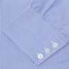 View 6 of product The Turnbull & Asser Blue Fine Bengal Stripe Shirt features a classic T&A collar, white buttons, and 3-button cuffs, displayed neatly folded against a plain white background.
