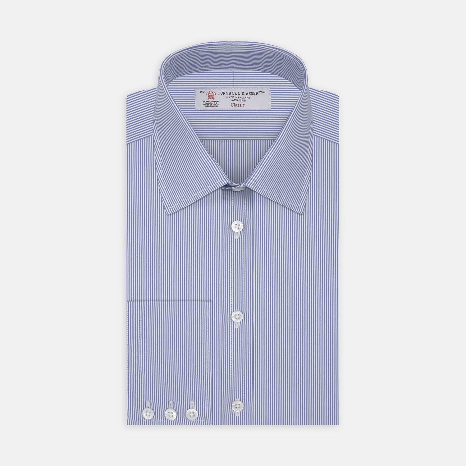 View 1 of product The Turnbull & Asser Blue Fine Bengal Stripe Shirt features a classic T&A collar, white buttons, and 3-button cuffs, displayed neatly folded against a plain white background.