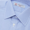 View 5 of product The Turnbull & Asser Blue Fine Bengal Stripe Shirt features a T&A collar, double cuffs, and white buttons, neatly folded and displayed against a plain white background.