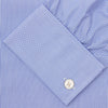 View 6 of product The Turnbull & Asser Blue Fine Bengal Stripe Shirt features a T&A collar, double cuffs, and white buttons, neatly folded and displayed against a plain white background.