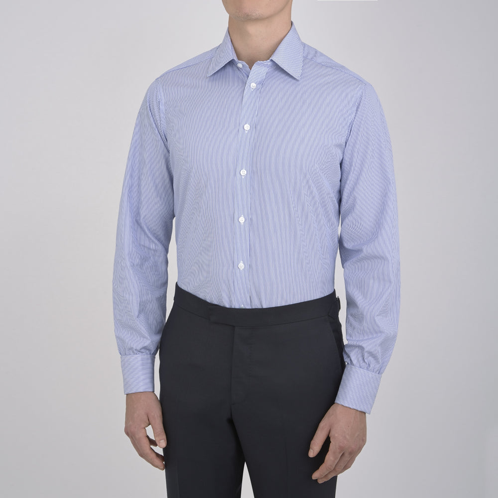 The Turnbull & Asser Blue Fine Bengal Stripe Shirt features a T&A collar, double cuffs, and white buttons, neatly folded and displayed against a plain white background.